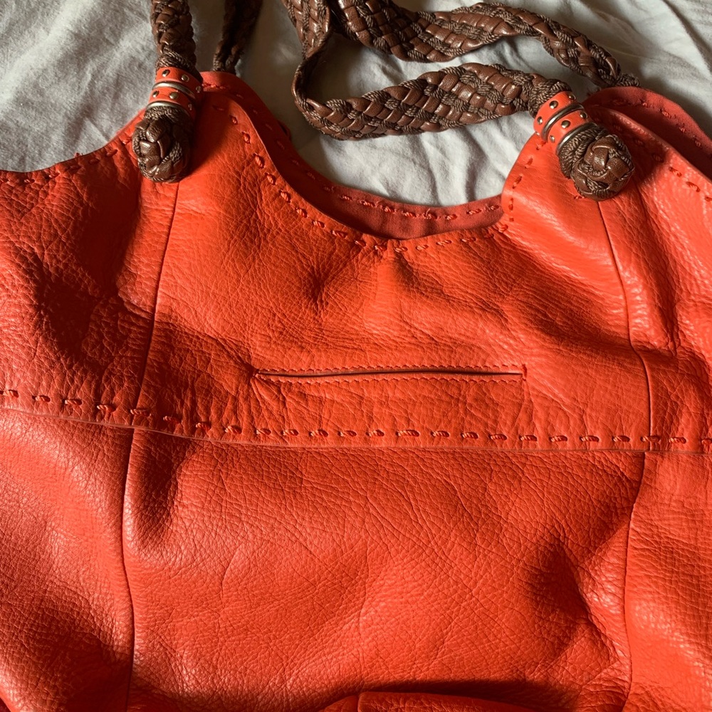 The Sak- genuine leather.